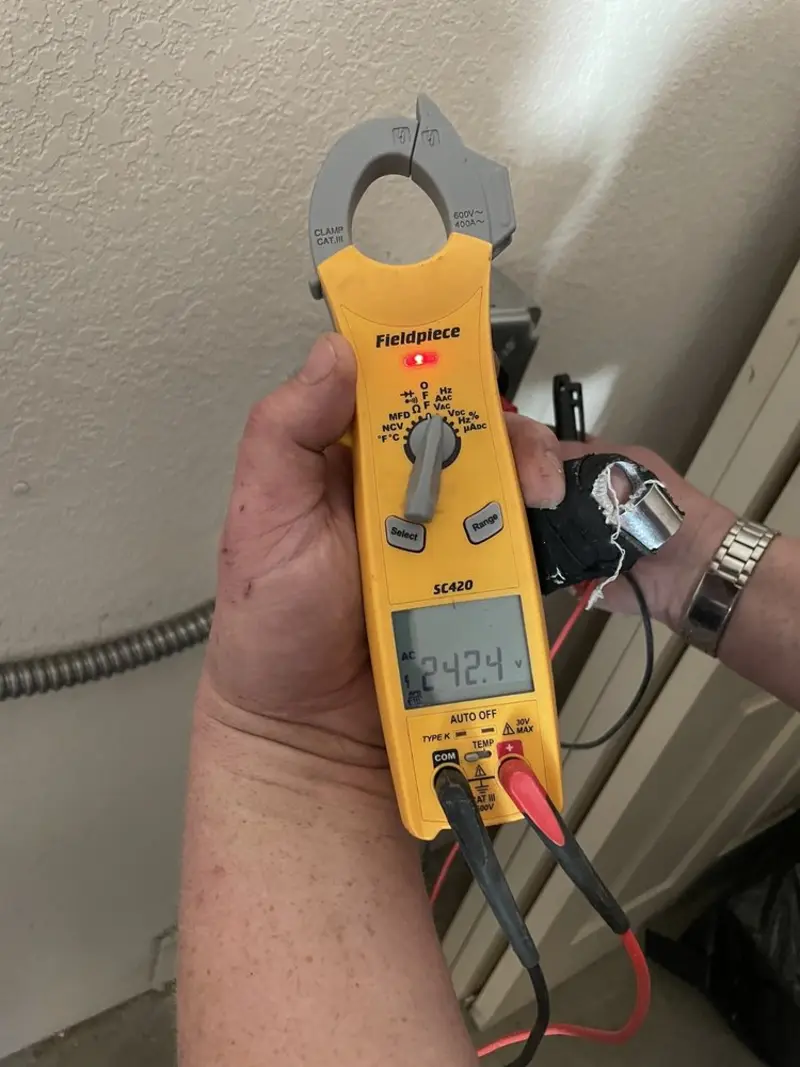 Voltage testing with clamp meter during Outlet Installation in Almont